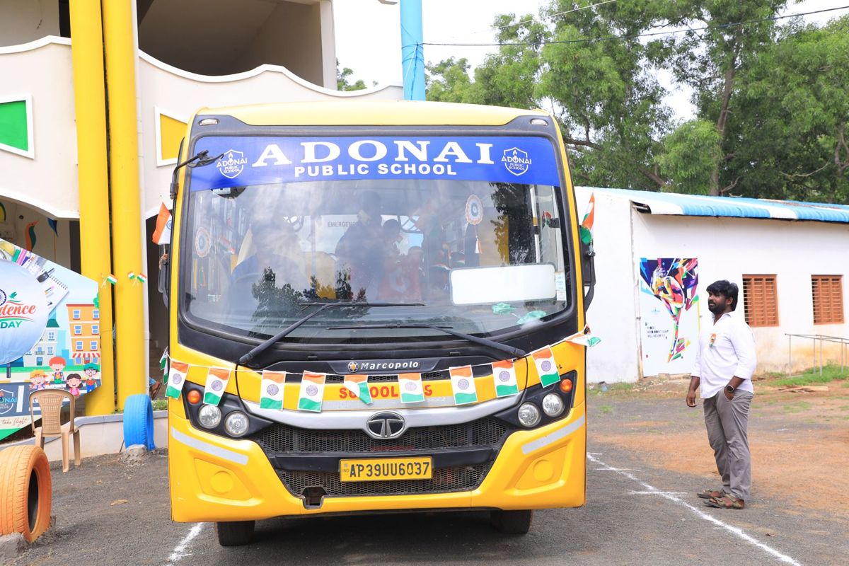 Adonai school bus decorated with flags