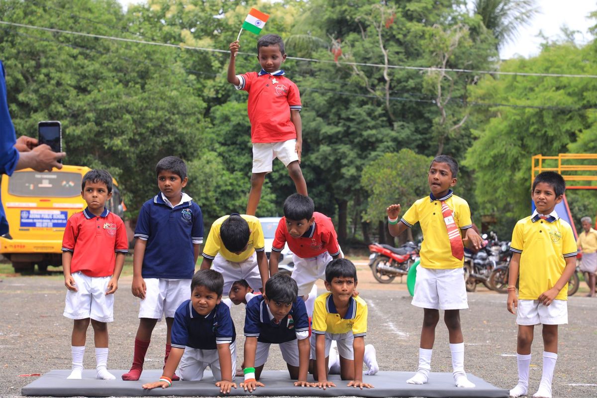 Boys forming a human pyramid during drill